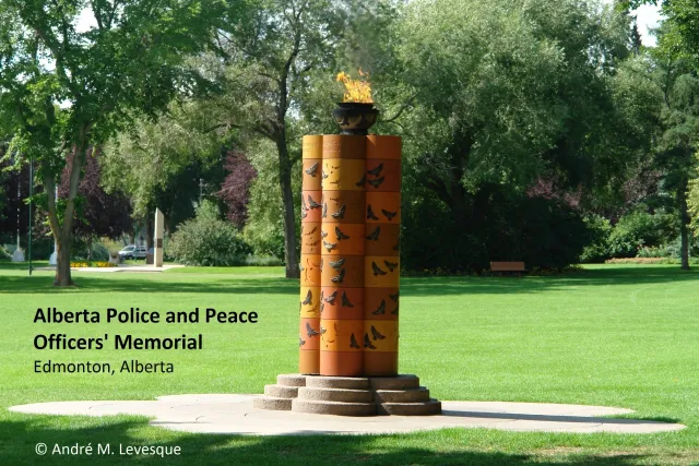 Why are there two members of the Canadian Armed Forces' Military Police memorialized on the Alberta Police and Peace Officers' Memorial?